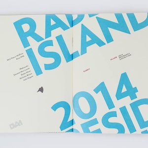 The cover of a softcover fully opened. The text Rabbit Island and 2014 Residency are large and set at an angle, full bleed and cut off at the edges of the cover.